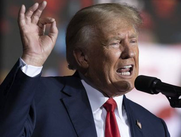 Donald Trump Jr. speaking at an event.